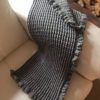 light grey crocheted baby blanket